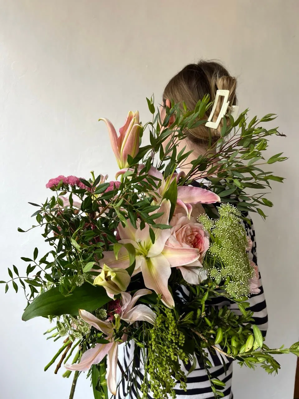Bouquet with lilies, roses and pistacia