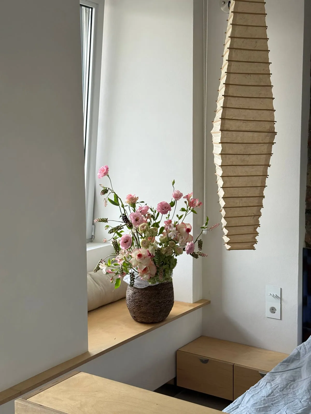 Basket arrangement with roses, lisianthus and pokeweed