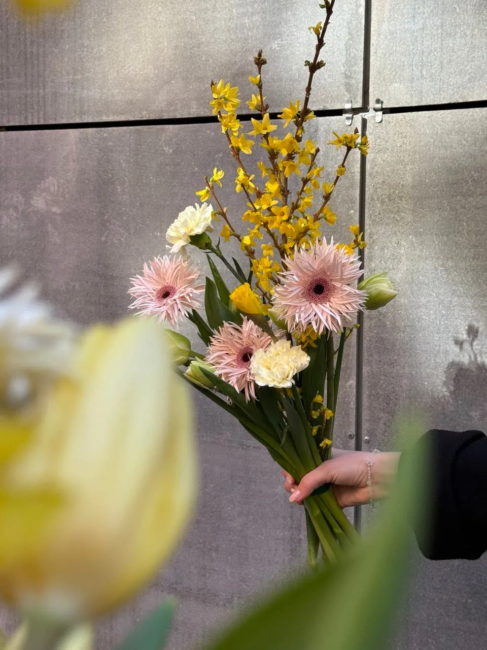 Spring bouquet with forsythia and gerberas