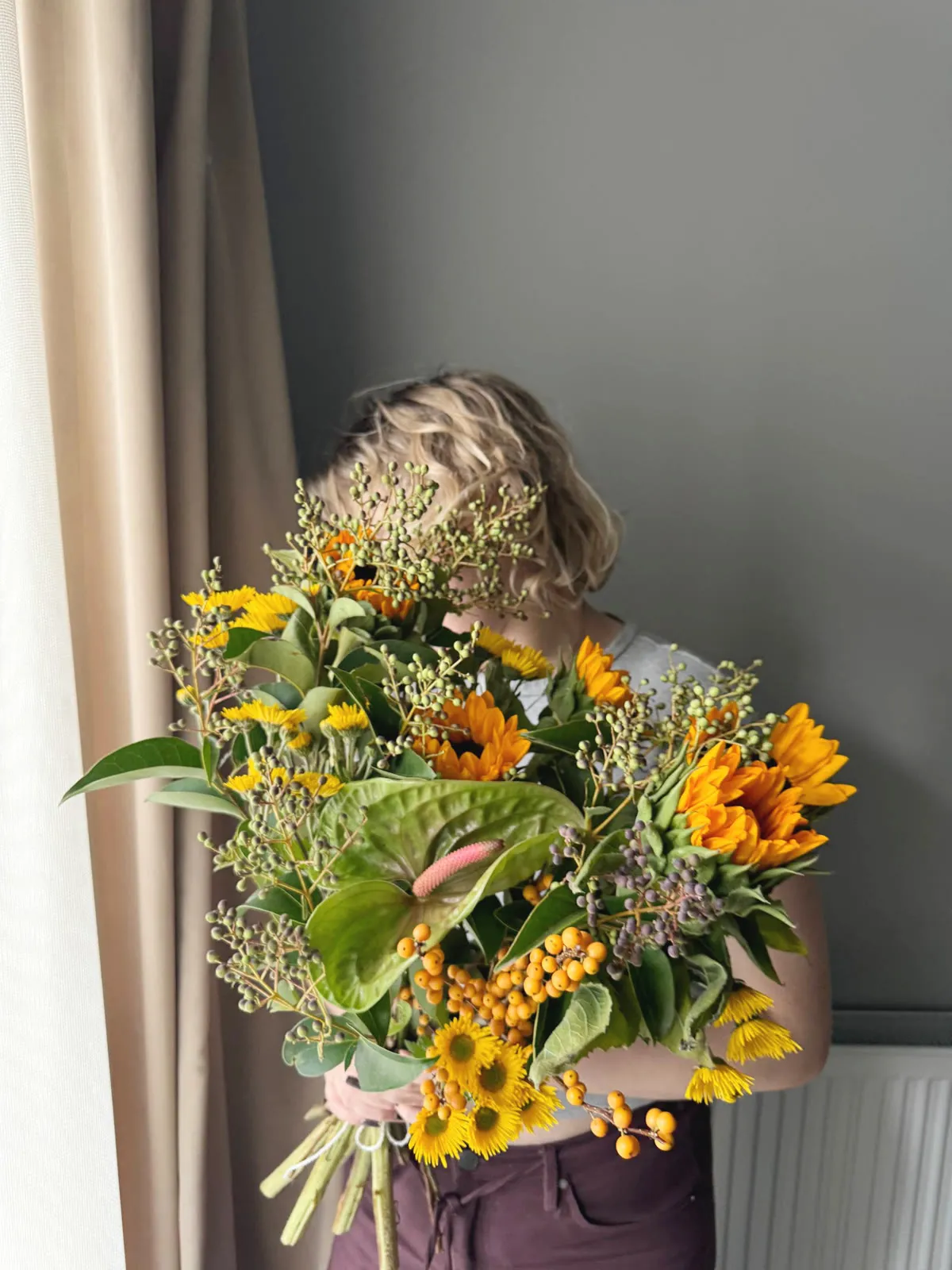 Sunflowers with sea buckthorn and anthurium