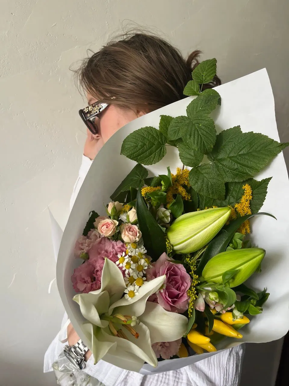 Bouquet with lilies, roses and solidago