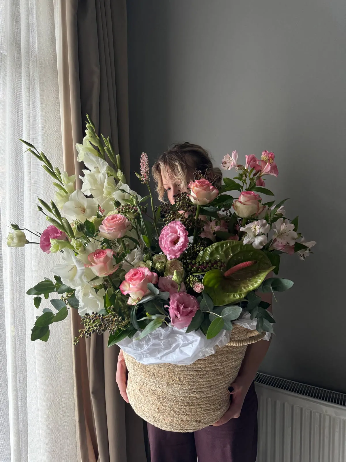 Basket of roses, gladioli and alstroemerias